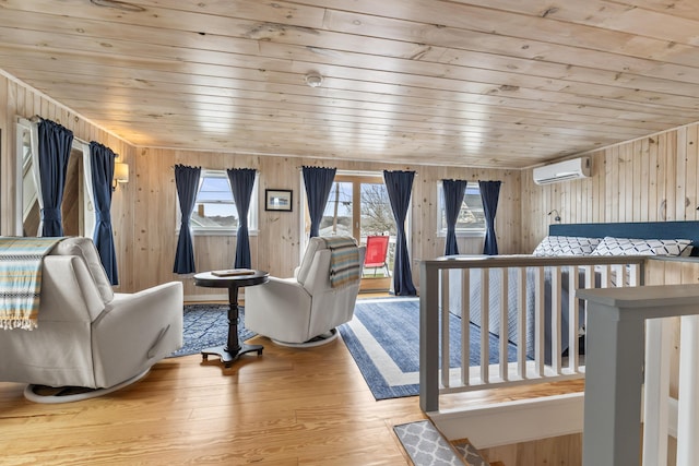 bedroom featuring wooden ceiling, wood finished floors, access to outside, wood walls, and a wall unit AC