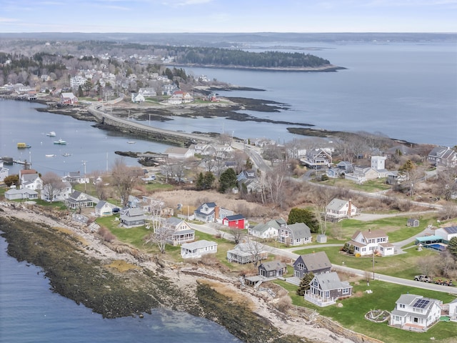 drone / aerial view featuring a water view and a residential view