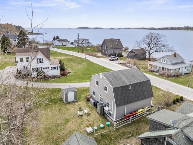 bird's eye view featuring a residential view and a water view
