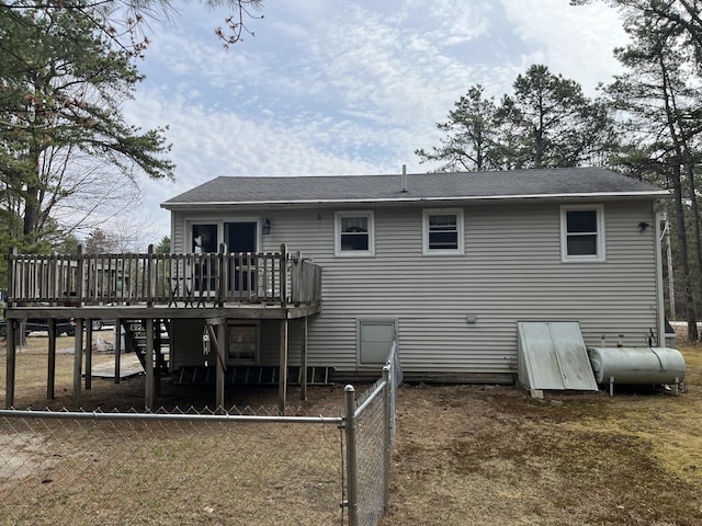 6 Northwood Cir, Hollis, ME 04042 - rear view of house with a wooden deck, heating fuel, stairs, roof with shingles, and fence