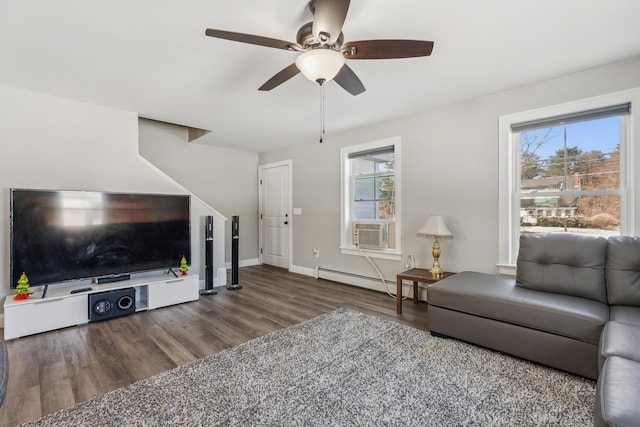living room featuring baseboards, a baseboard radiator, a ceiling fan, and wood finished floors