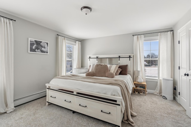 bedroom featuring light colored carpet, baseboards, a baseboard heating unit, and multiple windows