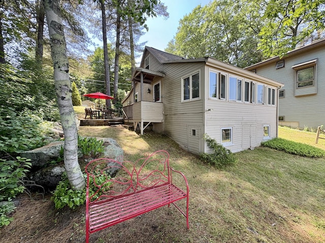 25-26 Mass Ave, Raymond, ME 04071 - view of side of home featuring a deck and a lawn