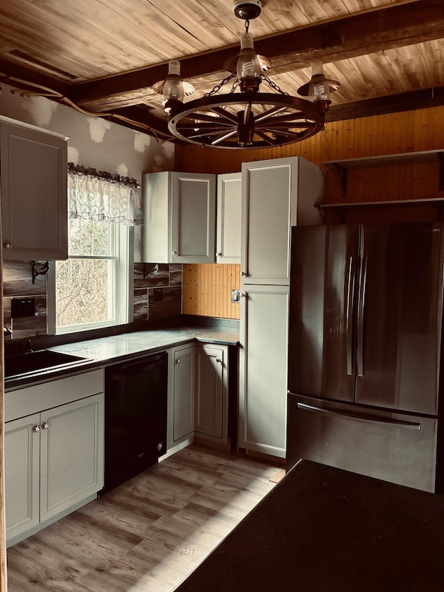 kitchen featuring wooden ceiling, freestanding refrigerator, black dishwasher, and light wood-style flooring