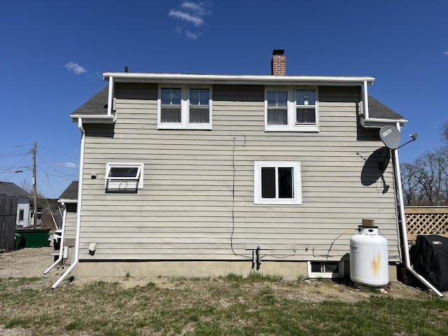6 Lyons St, Machias, ME 04654 - back of house featuring a chimney