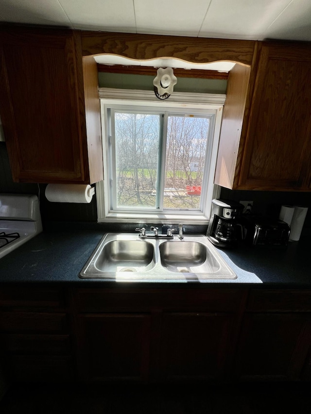 6 Lyons St, Machias, ME 04654 - kitchen featuring dark countertops and a sink