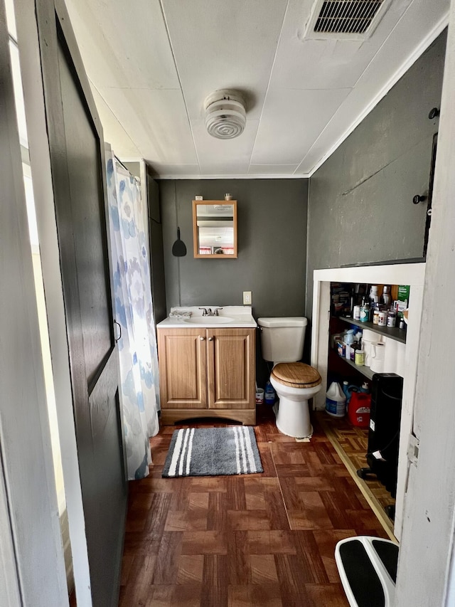 6 Lyons St, Machias, ME 04654 - bathroom featuring vanity, toilet, a shower with curtain, and visible vents