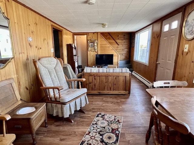 6 Lyons St, Machias, ME 04654 - interior space with dark wood-style flooring, wooden walls, and baseboard heating