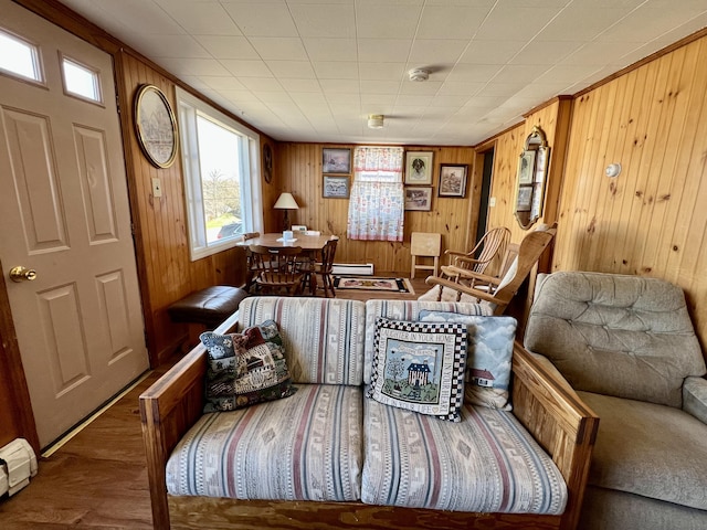 6 Lyons St, Machias, ME 04654 - living area with wood walls, wood finished floors, and a baseboard radiator
