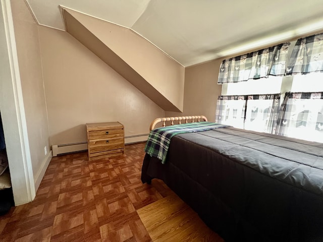 6 Lyons St, Machias, ME 04654 - bedroom featuring vaulted ceiling, baseboards, and a baseboard heating unit