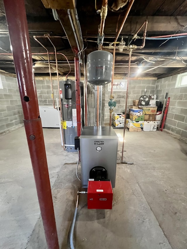 6 Lyons St, Machias, ME 04654 - utility room featuring hybrid water heater