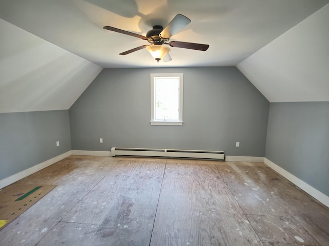 additional living space featuring vaulted ceiling, ceiling fan, baseboard heating, and baseboards