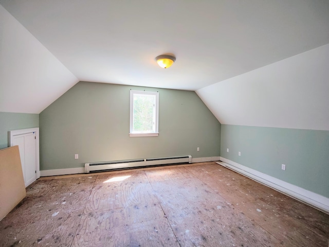 additional living space with baseboard heating and vaulted ceiling