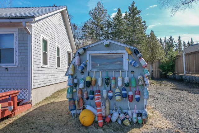 view of shed with fence