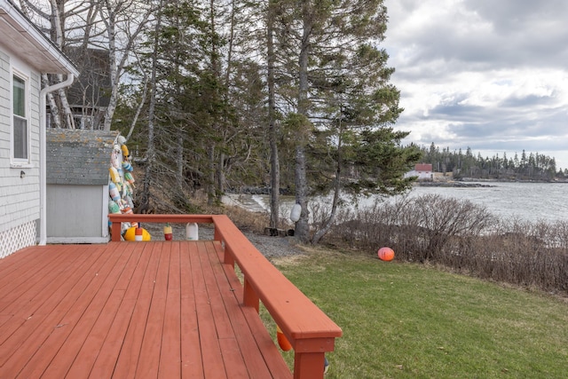 deck featuring a yard and a water view