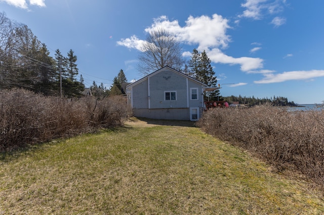 view of home's exterior featuring a yard