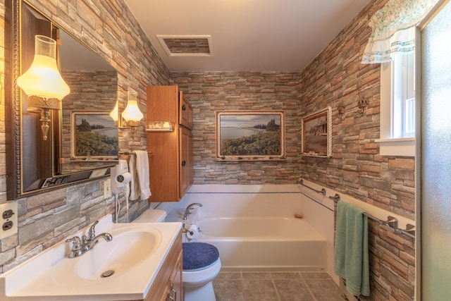 full bathroom with tile patterned floors, toilet, a bath, vanity, and visible vents