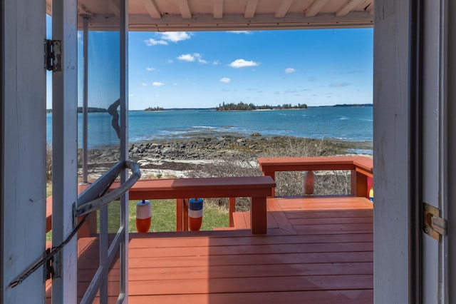 deck featuring a water view