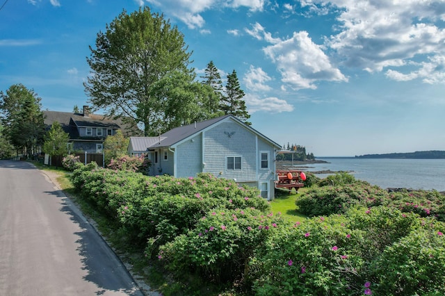 397 Cape Split Rd, Addison, ME 04606 - view of side of home featuring a water view and a metal roof