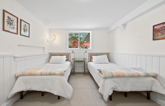 bedroom featuring carpet flooring, wainscoting, and ornamental molding
