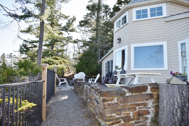 view of side of home featuring a fire pit