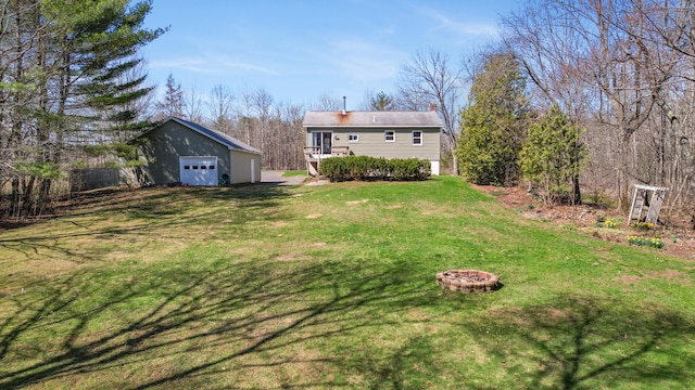 135 Williams Rd, Newport, ME 04953 - view of yard with an outdoor fire pit, a detached garage, and an outbuilding
