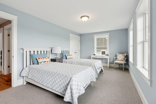 carpeted bedroom with baseboards