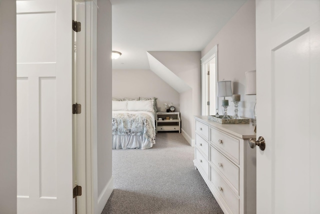 carpeted bedroom featuring baseboards