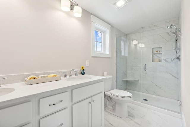 bathroom with vaulted ceiling, marble finish floor, toilet, a sink, and a marble finish shower