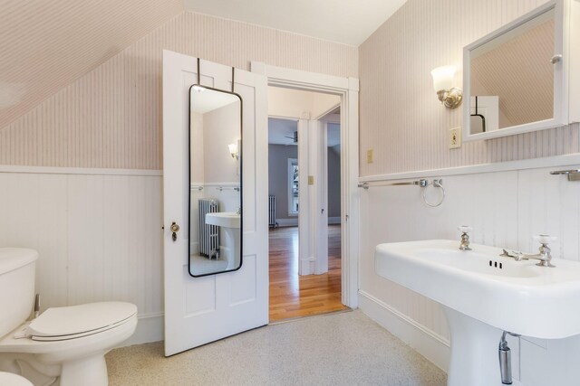 32 Webster Ave, Bangor, ME 04401 - half bathroom with wainscoting, toilet, wallpapered walls, and a sink