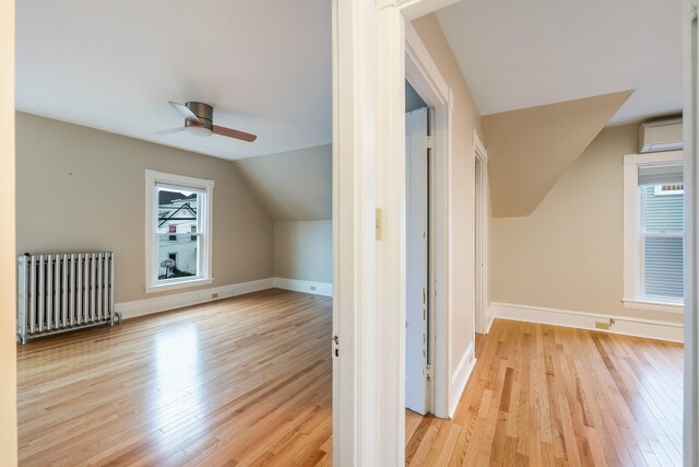 32 Webster Ave, Bangor, ME 04401 - bonus room with ceiling fan, baseboards, radiator, vaulted ceiling, and wood finished floors