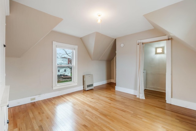 32 Webster Ave, Bangor, ME 04401 - additional living space with baseboards, light wood finished floors, and vaulted ceiling