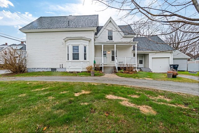 32 Webster Ave, Bangor, ME 04401 - view of front of house with aphalt driveway, roof with shingles, a porch, a front lawn, and a garage