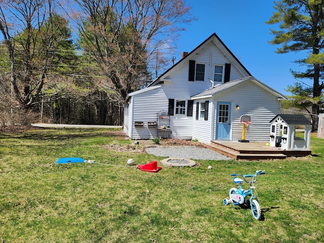 217 Washington Rd, Jefferson, ME 04348 - back of house featuring a wooden deck, a chimney, and a yard