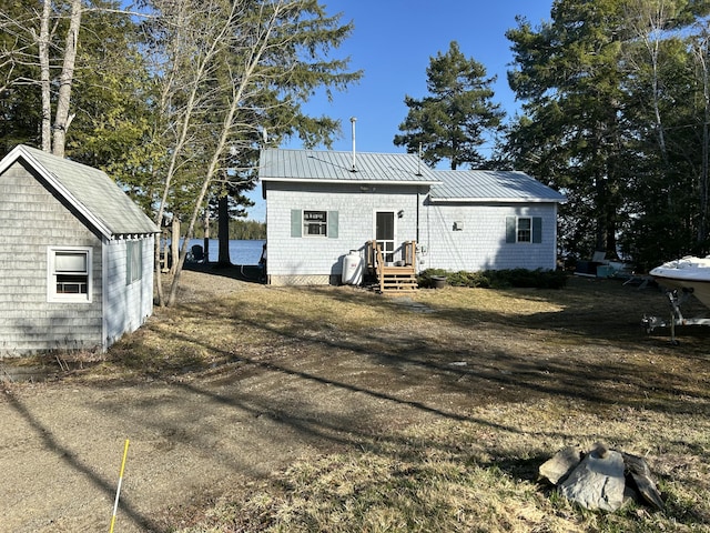 back of property with metal roof