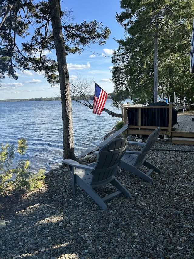 dock area featuring a deck with water view