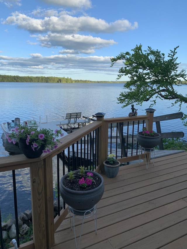 wooden deck featuring a water view