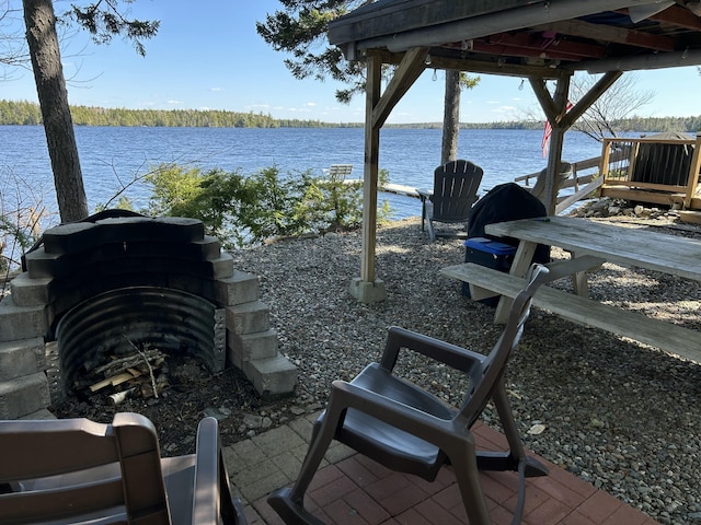 view of patio featuring a water view