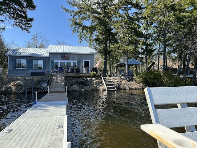 dock area with a deck with water view