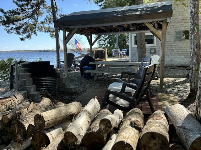 view of yard featuring a gazebo and a water view