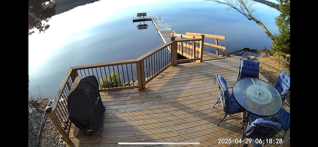 view of dock with a wooden deck