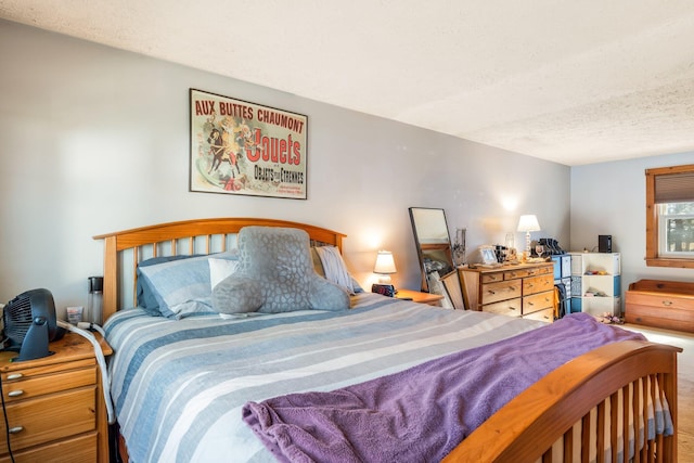bedroom with a textured ceiling and carpet