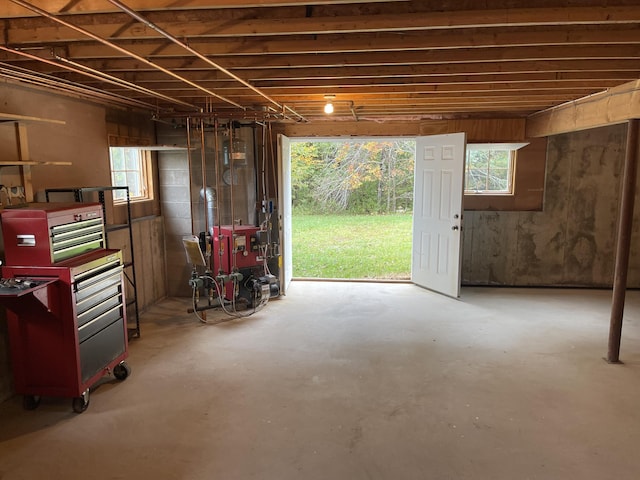 misc room featuring concrete flooring and a heating unit