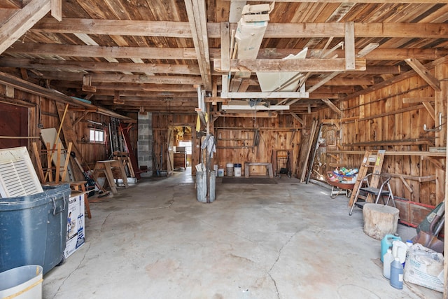 miscellaneous room with concrete flooring and a garage