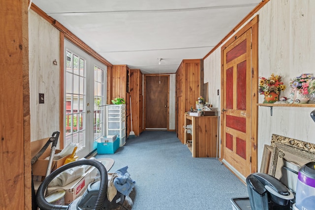 hallway featuring french doors and carpet