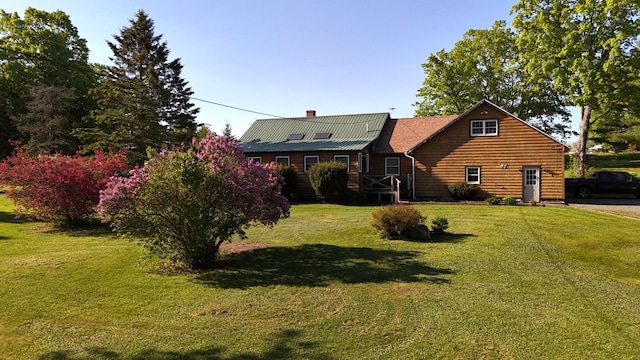 129 Ledge Hill Rd, Corinth, ME 04427 - view of front of property with a front lawn and a chimney