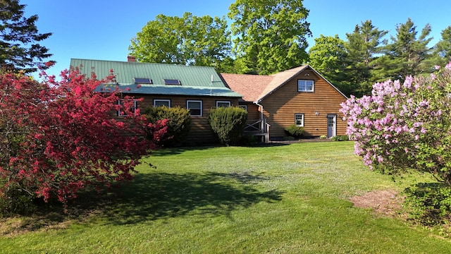 129 Ledge Hill Rd, Corinth, ME 04427 - back of property featuring a lawn and a chimney