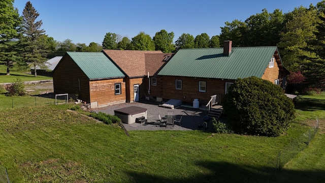 129 Ledge Hill Rd, Corinth, ME 04427 - back of house with a patio, a chimney, and metal roof