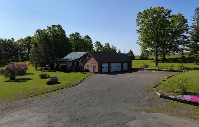 129 Ledge Hill Rd, Corinth, ME 04427 - ranch-style house with a front lawn and driveway