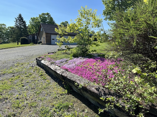 129 Ledge Hill Rd, Corinth, ME 04427 - view of yard featuring gravel driveway and an attached garage